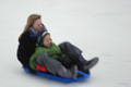 Cassidy and Asher sledding